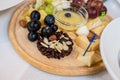 Cheese plate, grapes, nuts Royalty Free Stock Photo