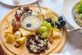 Cheese plate, grapes, nuts Royalty Free Stock Photo