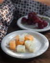 Cheese Plate with Red Seedless Grapes` Royalty Free Stock Photo