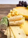 Cheese plate variation on a wooden table Royalty Free Stock Photo