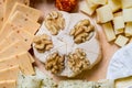 Cheese plate variation on a wooden table Royalty Free Stock Photo