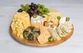 Cheese plate variation on a wooden white table Royalty Free Stock Photo