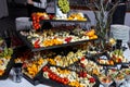 Cheese plate with variety of appetizers on table on event catering