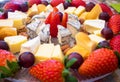 Cheese plate - various types of cheeses and strawberry. French cheeses Royalty Free Stock Photo