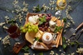 Cheese platter with assorted cheeses, grapes, nuts and snacks Royalty Free Stock Photo