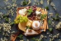 Cheese platter with assorted cheeses, grapes, nuts and snacks Royalty Free Stock Photo