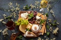 Cheese platter with assorted cheeses, grapes, nuts and snacks Royalty Free Stock Photo