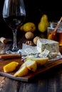 Cheese platter with blue cheese and pear. Wine snack. Italian cuisine. Vegetarian food. Healthy eating