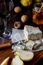 Cheese platter with blue cheese and pear. Wine snack. Italian cuisine. Vegetarian food. Healthy eating