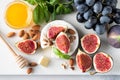 Cheese platter with brie or camembert, figs, grapes, nuts and honey