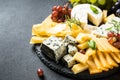 Cheese platter with craft cheese assortment on slate board. Royalty Free Stock Photo