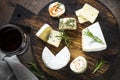 Cheese platter on dark stone table.