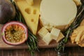 Cheese platter with fruits. Cheese board set. assorted cheese on a wooden board with herbs and fruits.Cheese cut with Royalty Free Stock Photo