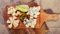 Cheese platter garnished with honey and apple Royalty Free Stock Photo