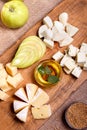 Cheese platter garnished with honey, apple and spice Royalty Free Stock Photo