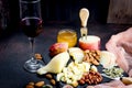 Cheese platter and glass of red wine