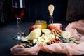 Cheese platter and glass of red wine