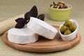 Cheese platter with nuts and grapes and olives Royalty Free Stock Photo