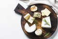 Cheese platter on white table.