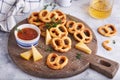Cheese pretzels snacks pastries served with sauce and thyme