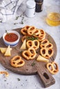 Cheese pretzels snacks pastries served with sauce and thyme