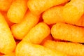 Cheese puff. Cheese puffs snack background texture food pattern. Royalty Free Stock Photo