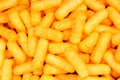Cheese puff. Cheese puffs snack background texture food pattern. Royalty Free Stock Photo
