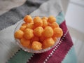 Cheese puffs balls, cheese curls, cheese ball puffs, cheesy puffs, or corn curls are a puffed corn snack. Royalty Free Stock Photo