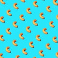 Cheese puffs in a repeating pattern on a blue background Royalty Free Stock Photo
