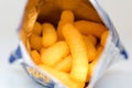 Cheese puffs snack in silver foiled package Royalty Free Stock Photo