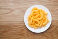 cheese puffs in a white plate Royalty Free Stock Photo