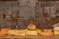 Cheese with raclette in ripening cellar Royalty Free Stock Photo