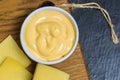 Cheese sauce on a black background. Place for your text. Royalty Free Stock Photo