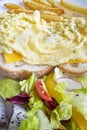 Cheese scram bled egg, white bread loaf, mixed greens and french fries Royalty Free Stock Photo