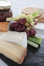 Cheese selection on slate platter Royalty Free Stock Photo