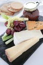Cheese selection on slate platter Royalty Free Stock Photo