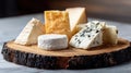Cheese selection on wooden board with knife Royalty Free Stock Photo