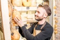 Cheese seller at the shop Royalty Free Stock Photo