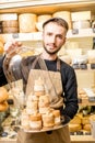 Cheese seller at the shop Royalty Free Stock Photo