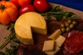 Cheese with serrano ham, olives on a table for a party with friends or as an aperitif Royalty Free Stock Photo