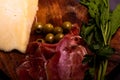 Cheese with serrano ham, olives on a table for a party with friends or as an aperitif