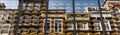 Cheese shop in Amsterdam with traditional Dutch houses reflected in window. Royalty Free Stock Photo