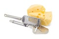 Cheese slicer and grater near of pieces of cheese