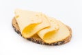 Cheese slices on bread. White background. Royalty Free Stock Photo