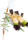 Cheese snack with tofu, green pepper, nori leaves on a wooden tray