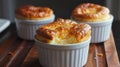 Cheese souffles in white ramekins Royalty Free Stock Photo