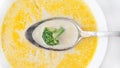 Cheese soup with broccoli in a white plate on a white linen tablecloth Royalty Free Stock Photo