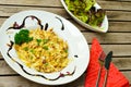 Cheese spaetzle on a plate with a salad. Royalty Free Stock Photo