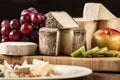 Cheese specialties on wood plate. Royalty Free Stock Photo