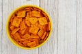 Cheese square crackers in bowl on table Royalty Free Stock Photo
